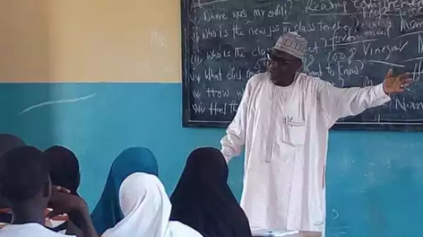 Photos: A Local Government Chairman is pictured teaching primary school pupils in Borno state